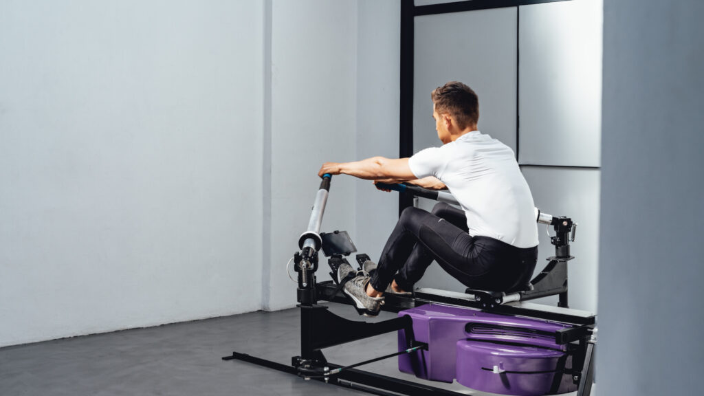 Experienced male athlete training on the BioRower Pro indoor rowing machine